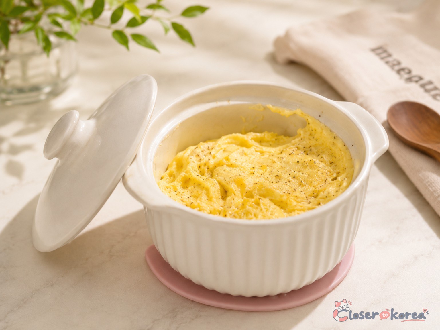 Cooked gyeran-jjim served in a white ceramic Korean microwave steamed egg cooker